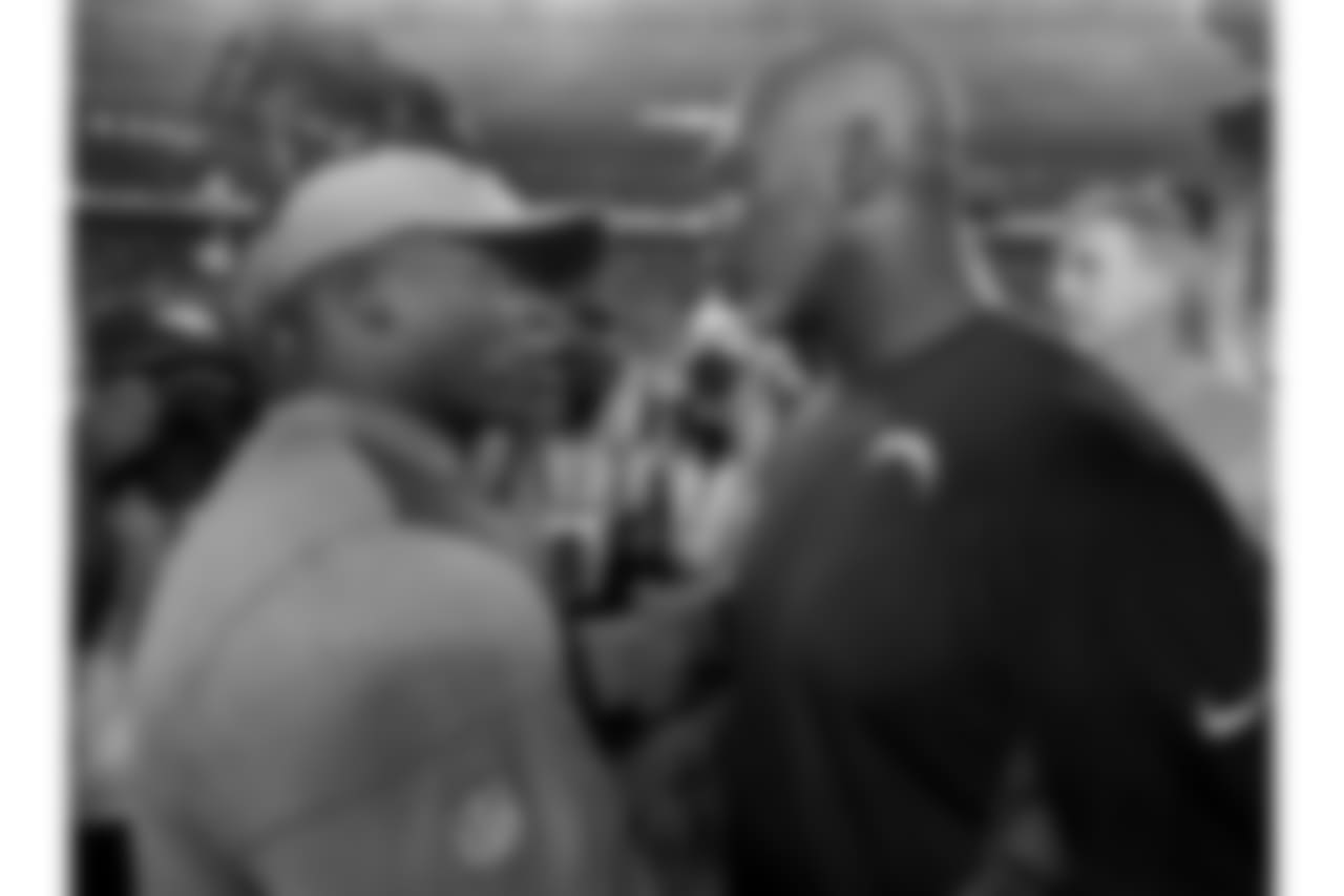 Denver Broncos head coach Vance Joseph, left, greets Los Angeles Chargers head coach Anthony Lynn after an NFL football game, Monday, Sept. 11, 2017, in Denver. The Broncos won 24-21. (AP Photo/Jack Dempsey)