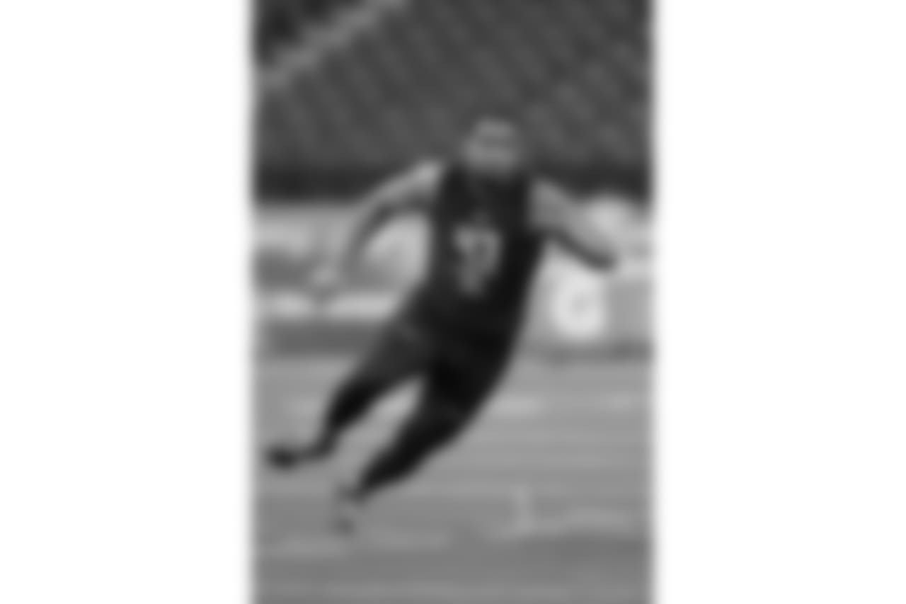Utah offensive lineman Sam Tevi runs a drill at the NFL football scouting combine in Indianapolis, Friday, March 3, 2017. (AP Photo/Michael Conroy)