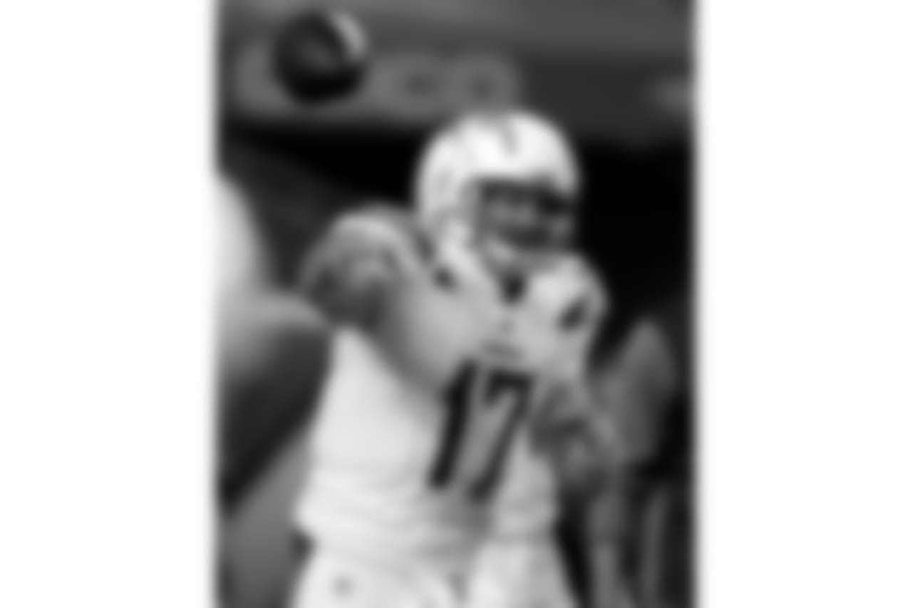 Los Angeles Chargers quarterback Philip Rivers (17) warms up prior to an NFL football game against the Denver Broncos, Monday, Sept. 11, 2017, in Denver. (AP Photo/David Zalubowski)