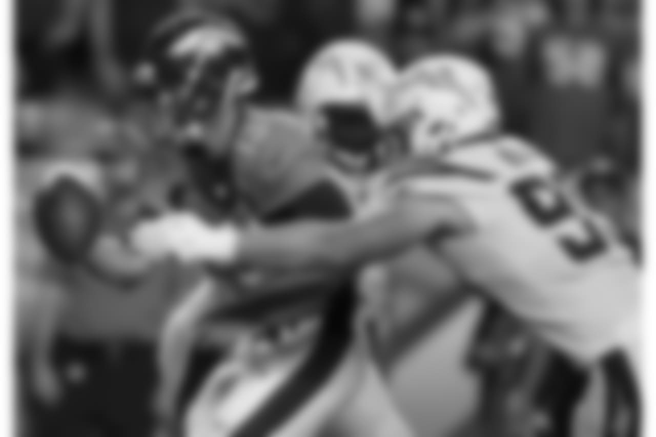 Denver Broncos quarterback Trevor Siemian (13) is hit by Los Angeles Chargers defensive end Joey Bosa (99) during the second half of an NFL football game, Monday, Sept. 11, 2017, in Denver. (AP Photo/David Zalubowski)