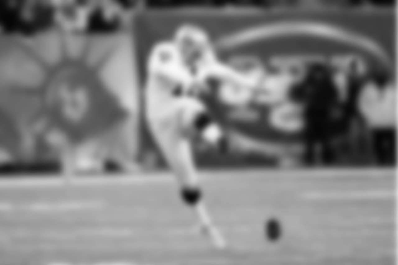Oakland Raiders kicker Sebastian Janikowski (11) tries for an on-side kick against the New York Jets during the second half of an NFL football game, Sunday, Dec. 8, 2013, in East Rutherford, N.J. The Jets won 37-27. (AP Photo/Kathy Willens)