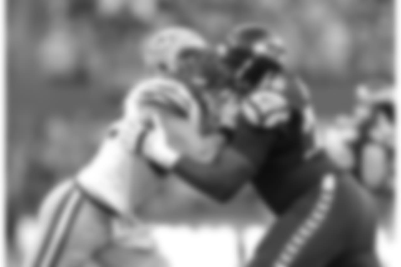 Seattle Seahawksoffensive lineman Russell Okung (76) battles during an NFL football game against Green Bay Packers linebacker Clay Matthews (52) on Thursday, Sept. 4, 2014, in Seattle, Wa. The Seahawks won the game, 36-16. (AP Photo/Greg Trott)