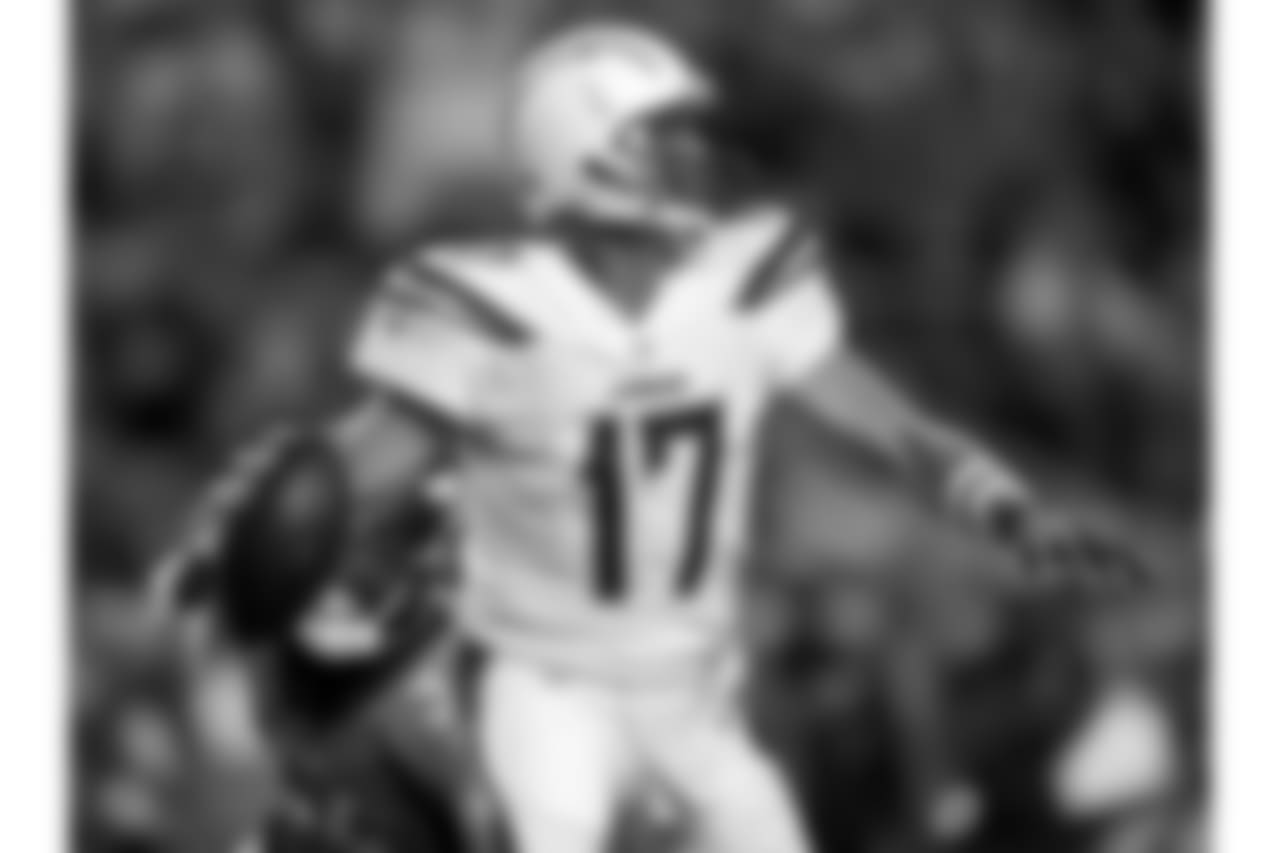 Los Angeles Chargers quarterback Philip Rivers (17) scrambles against the Denver Broncos during the first half of an NFL football game, Monday, Sept. 11, 2017, in Denver. (AP Photo/David Zalubowski)