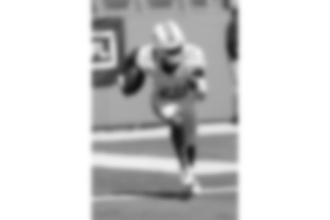 Miami Dolphins cornerback Bobby McCain (28) runs with the ball while warming up before the 2016 NFL week 5 regular season football game against the Tennessee Titans on Sunday, Oct. 9, 2016 in Miami Gardens, Fla. The Titans won the game 30-17. (Paul Spinelli via AP)