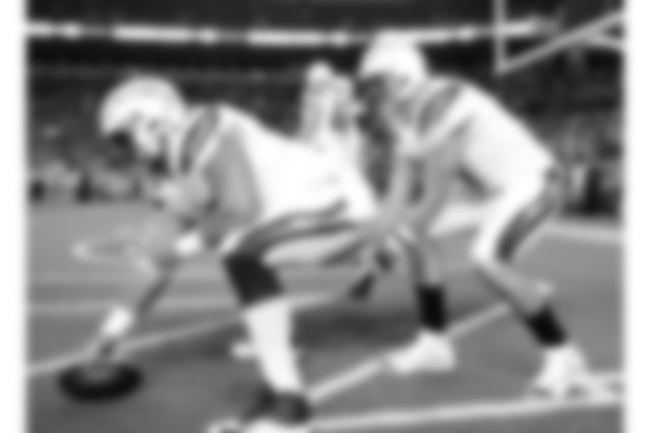 Los Angeles Chargers quarterback Philip Rivers (17) warms up under center Spencer Pulley prior to an NFL football game against the Denver Broncos, Monday, Sept. 11, 2017, in Denver. (AP Photo/Jack Dempsey)
