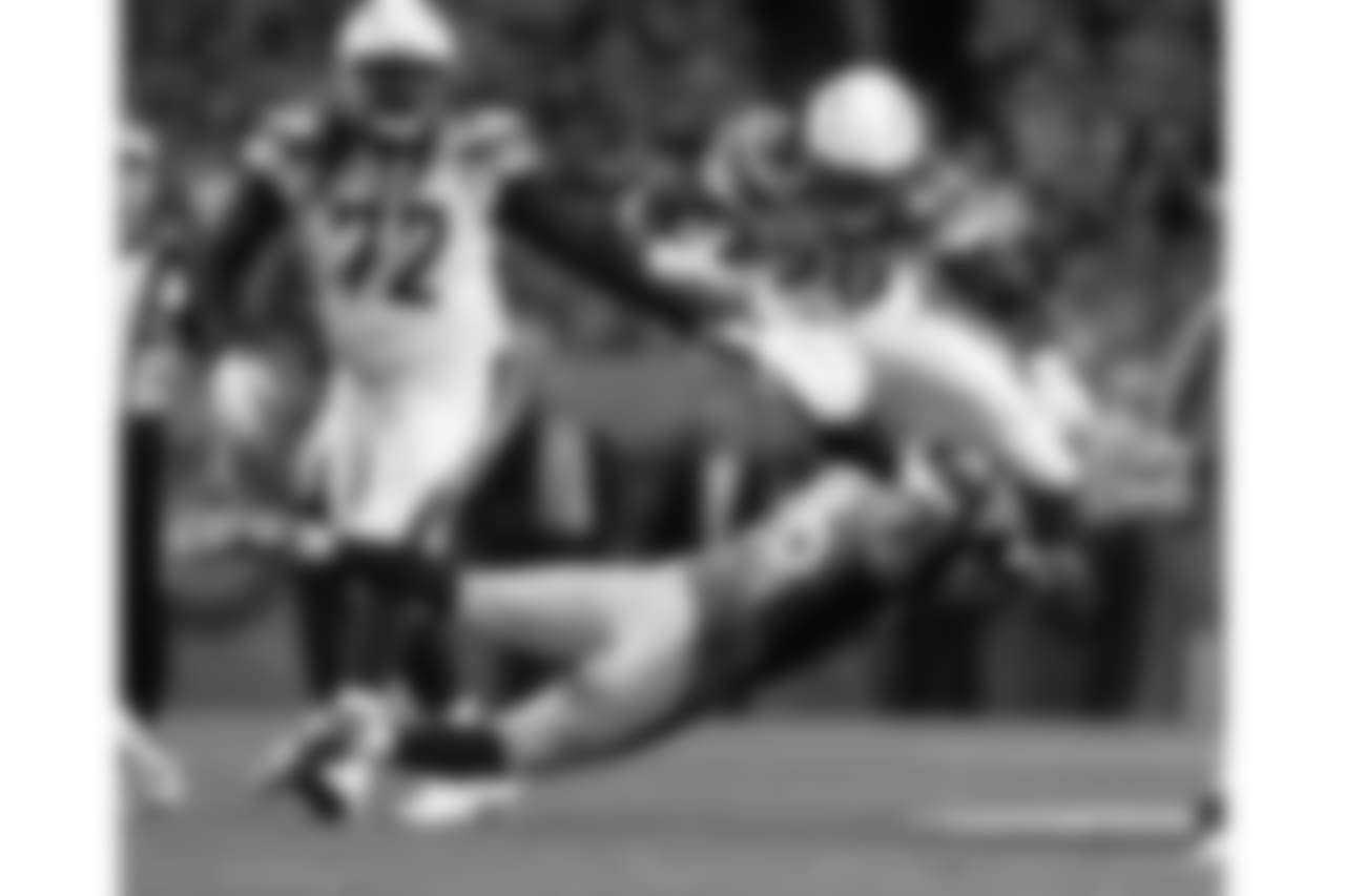 Los Angeles Chargers running back Melvin Gordon (28) is hit by Denver Broncos free safety Darian Stewart (26) during the first half of an NFL football game, Monday, Sept. 11, 2017, in Denver. (AP Photo/Jack Dempsey)