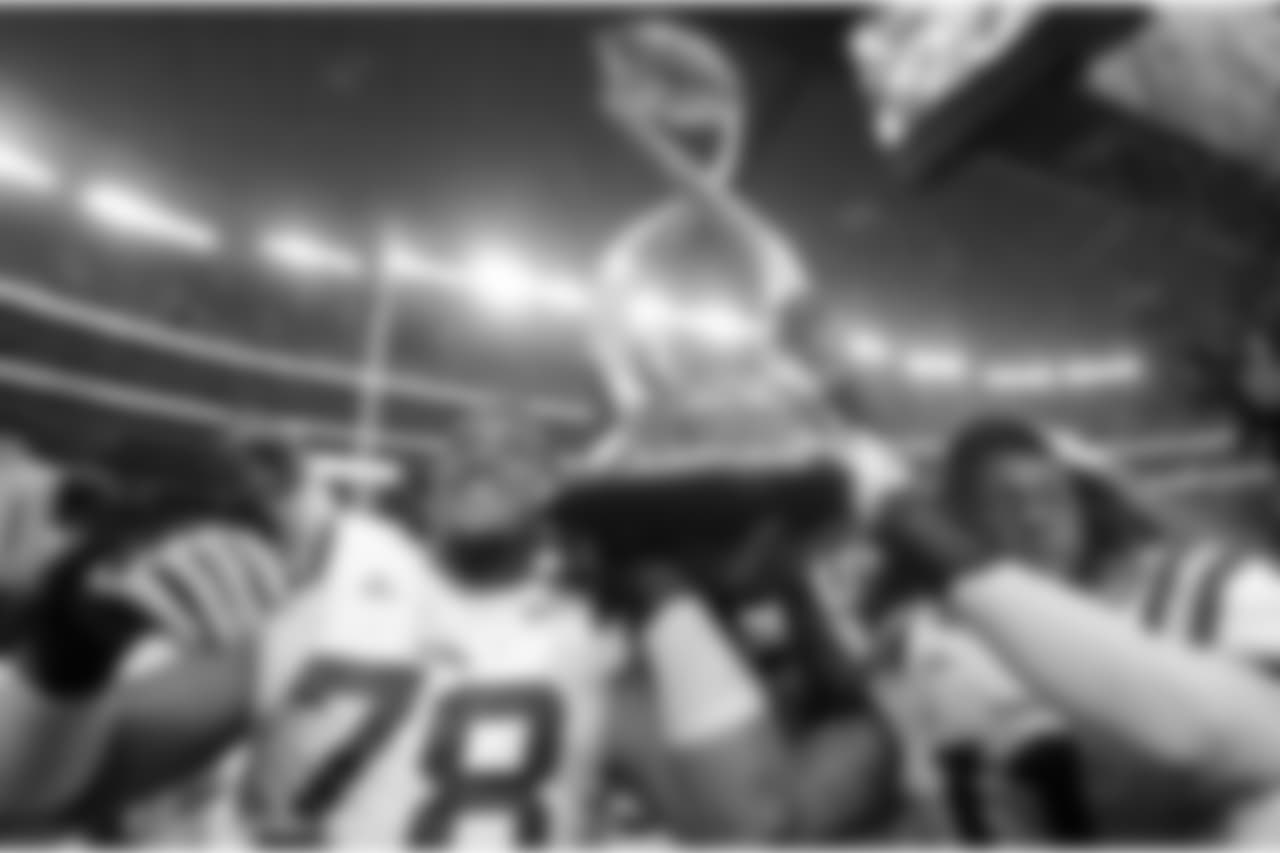 LSU players Joseph Barksdale, left, and Kelvin Sheppard carry the Cotton Bowl championship trophy after winning the NCAA college football game against Texas A&M 41-24, Friday, Jan. 7, 2011, in Arlington, Texas. (AP Photo/Tony Gutierrez)