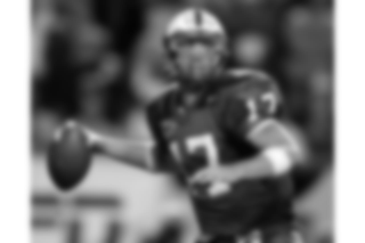 North Carolina State quarterback Philip Rivers (17) drops back to pass during his team's 17-15 win over Clemson on Thursday, Oct. 16, 2003, in Raleigh, N.C. (AP Photo/Grant Halverson)