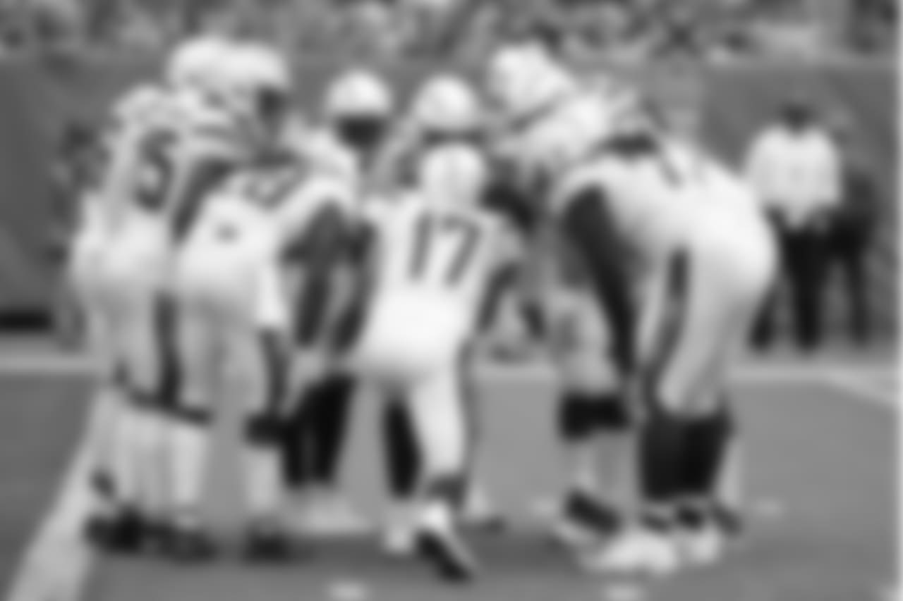 Los Angeles Chargers quarterback Philip Rivers (17) huddles with teammates against the New York Giants during the first half of an NFL football game, Sunday, Oct. 8, 2017, in East Rutherford, N.J. (AP Photo/Seth Wenig)