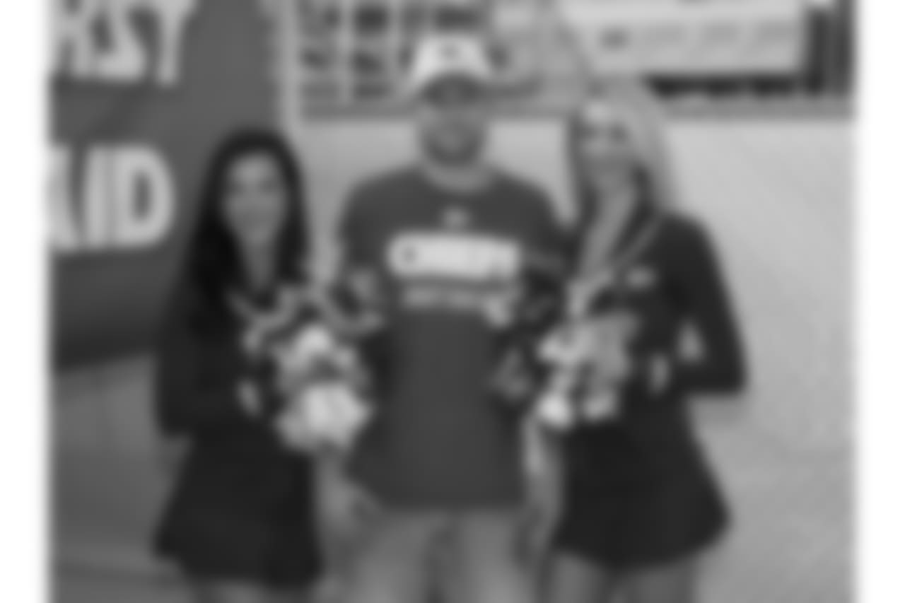 Fans get their photo taken with Chiefs Cheerleaders during practice on 8/4/18 at Chiefs Training Camp at Missouri Western State University in St. Joseph, Missouri.