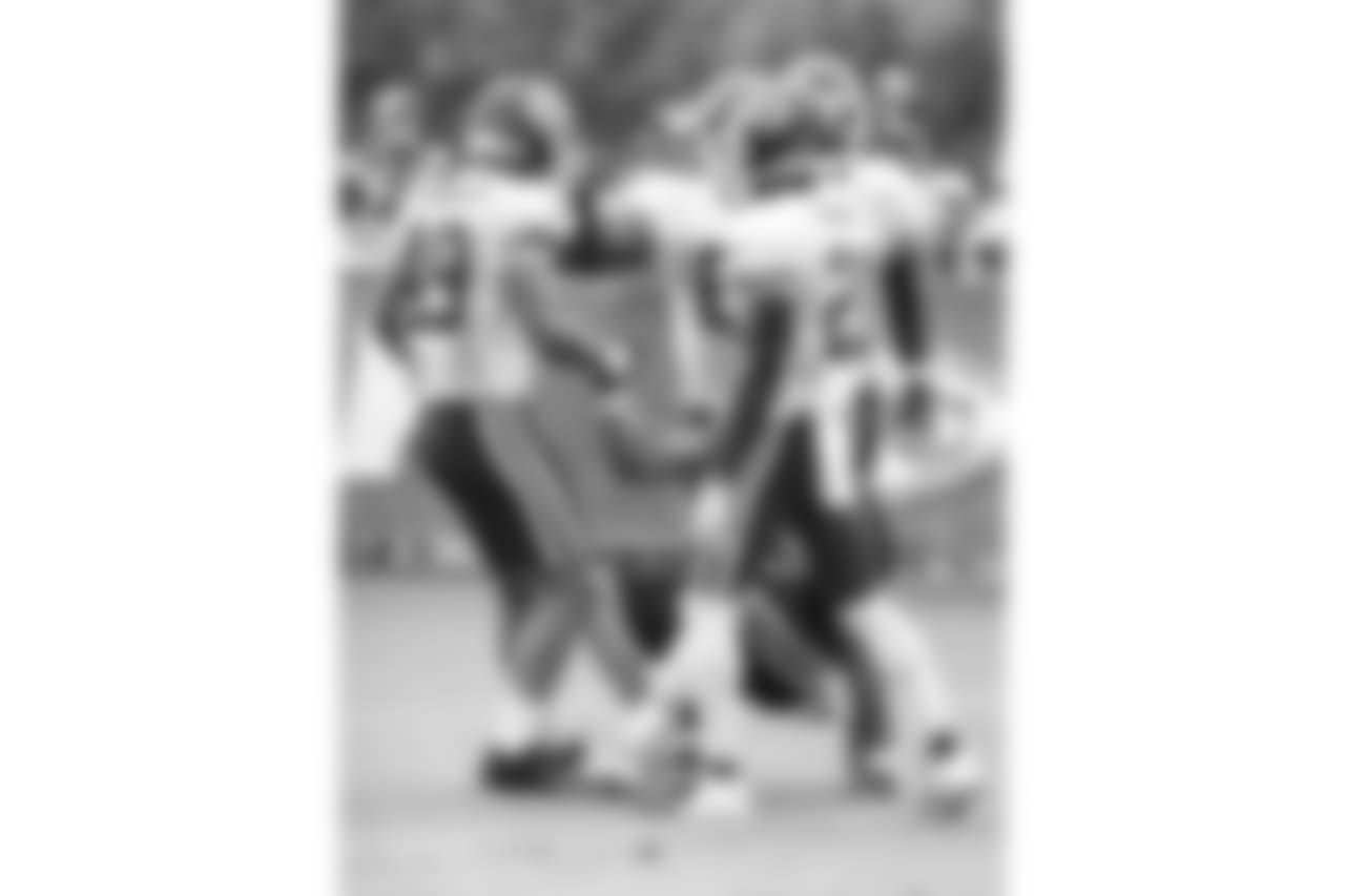 Kansas City Chiefs defensive back Daniel Sorensen (49) helps a teammate up during practice 8/4/18 at Chiefs Training Camp at Missouri Western State University in St Joseph, Missouri