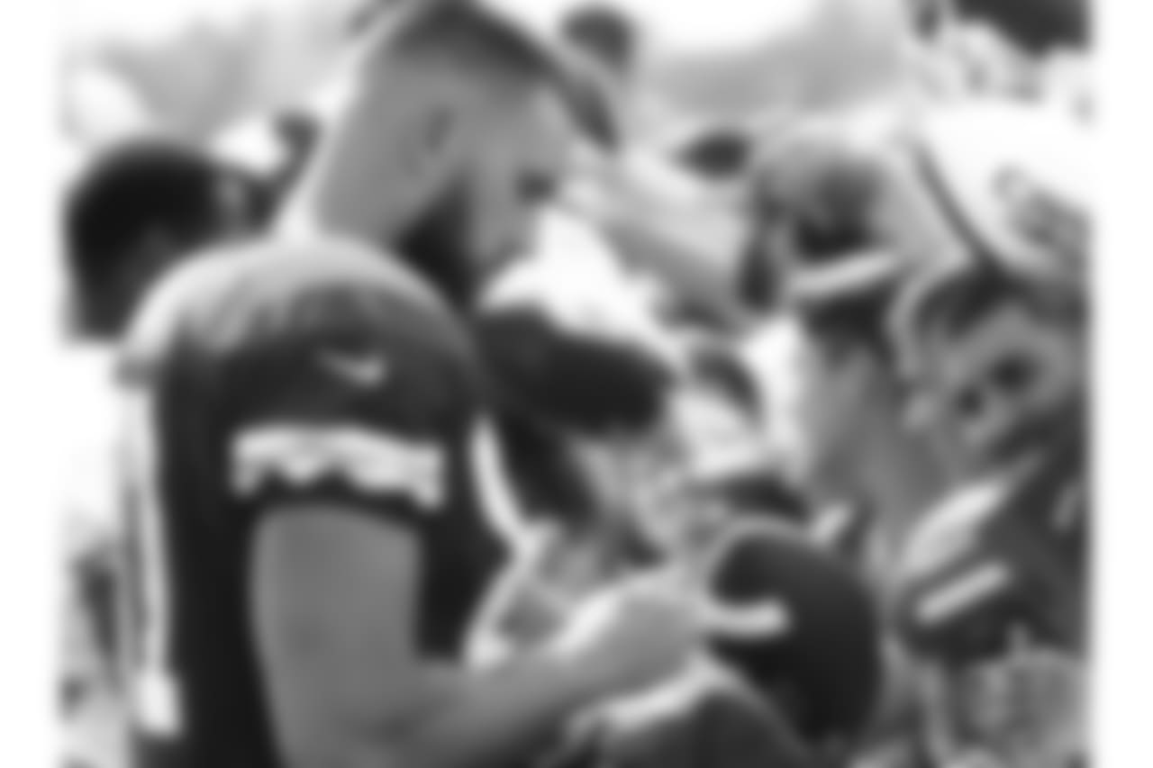 Kansas City Chiefs tight end Travis Kelce (87) signs autographs after during practice 8/4/18 at Chiefs Training Camp at Missouri Western State University in St Joseph, Missouri