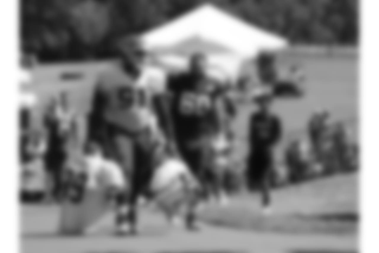 Kansas City Chiefs defensive tackle Derrick Nnadi (91) and offensive tackle Ryan Hunter (60)after practice 7/28/18 at Chiefs Training Camp at Missouri Western State University in St Joseph, Missouri