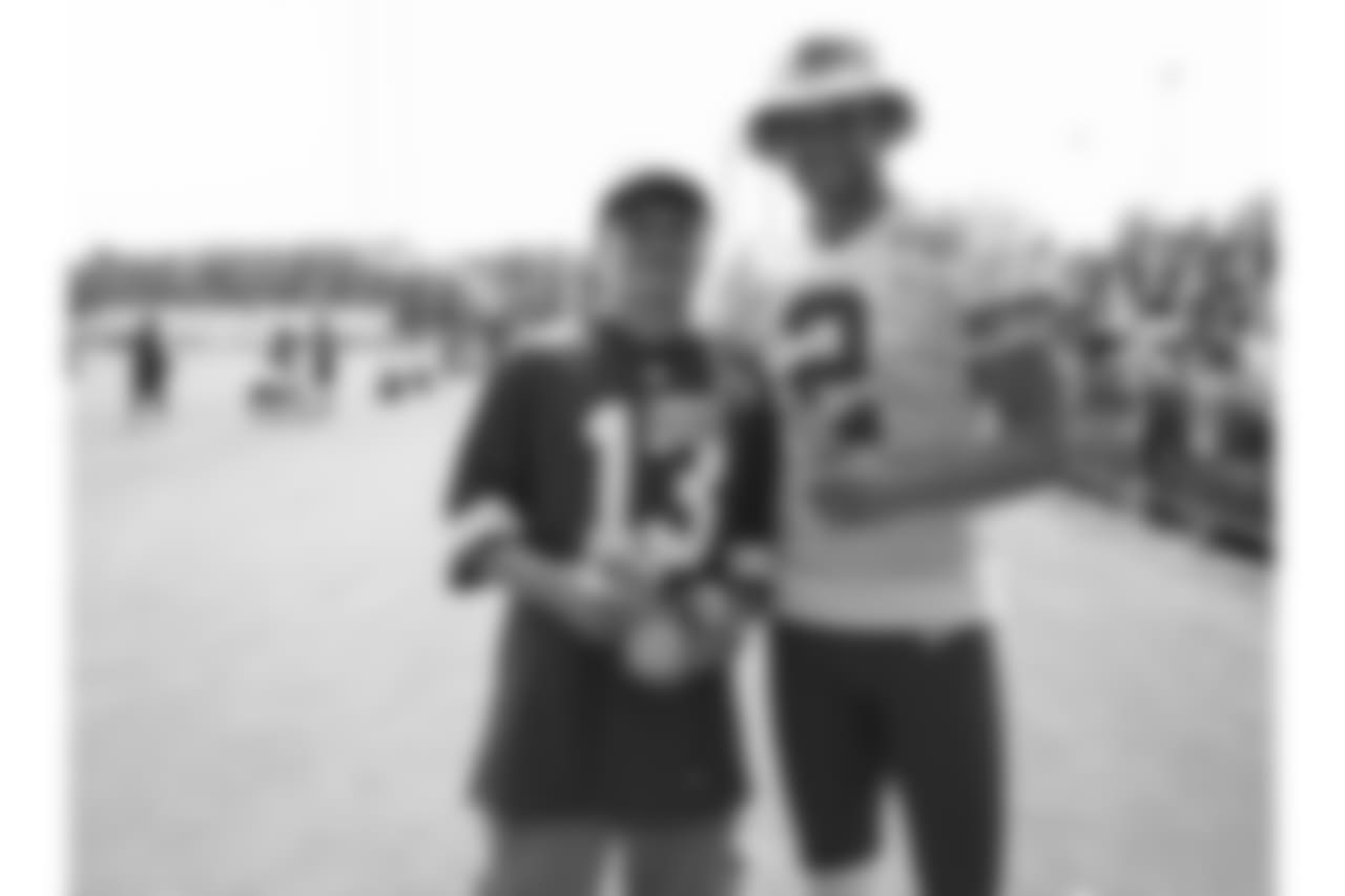 Kansas City Chiefs punter Dustin Colquitt (2) and Brayden the Gatorade Kid Experience winner during practice on 08/05/18 at Chiefs Training Camp at Missouri Western State University in St. Joseph, Missouri.