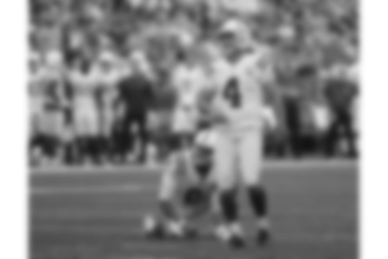 Indianapolis Colts kicker Adam Vinatieri (4) and holder Rigoberto Sanchez (2) look on after Vinatieri kicked a field goal against the Seattle Seahawks during the first half of an NFL football preseason game, Thursday, Aug. 9, 2018, in Seattle. (AP Photo/Elaine Thompson)