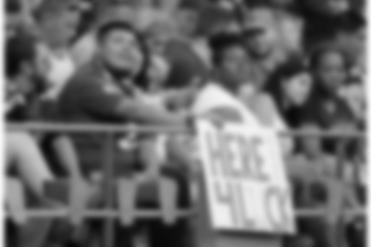 A fan holds a sign that reads "Here 4 Luck" in support of Indianapolis Colts quarterback Andrew Luck during the first half of an NFL football preseason game against the Seattle Seahawks, Thursday, Aug. 9, 2018, in Seattle. (AP Photo/Stephen Brashear)