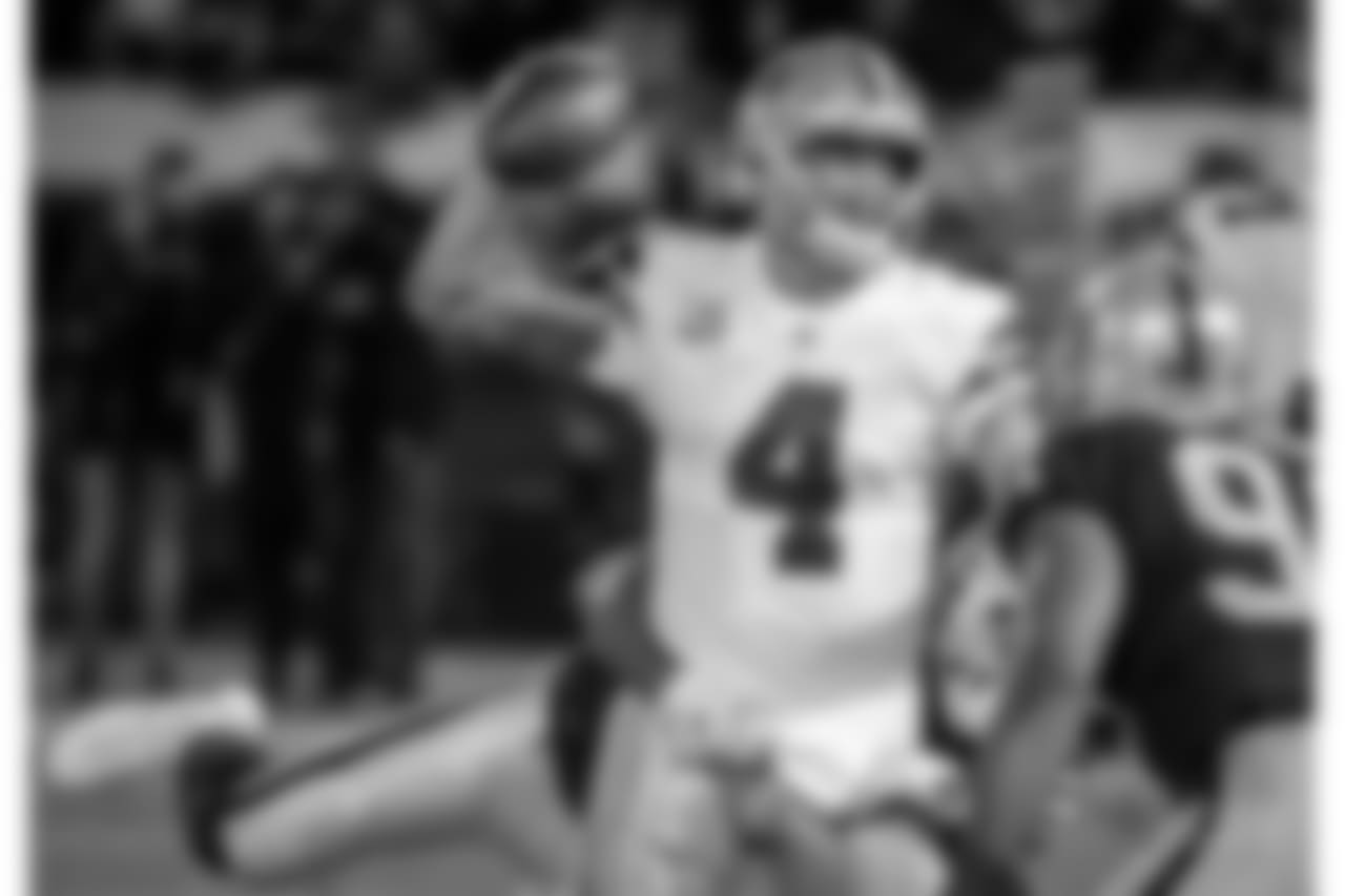 Dallas Cowboys quarterback Dak Prescott (4) passes against the Oakland Raiders during the first half of an NFL football game in Oakland, Calif., Sunday, Dec. 17, 2017. (AP Photo/Eric Risberg)
