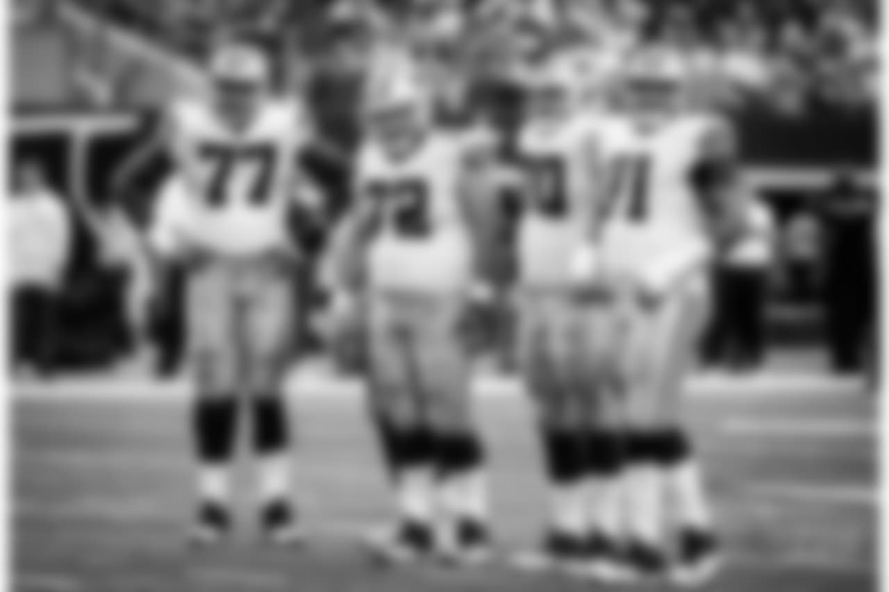 Dallas Cowboys' Tyron Smith (77), Travis Frederick (72), Zack Martin (70) an dLa'el Collins (71) stand at the line of scrimmage during an NFL football game against the Green Bay Packers on Sunday, Oct. 8, 2017, in Arlington, Texas. (AP Photo/Michael Ainsworth)