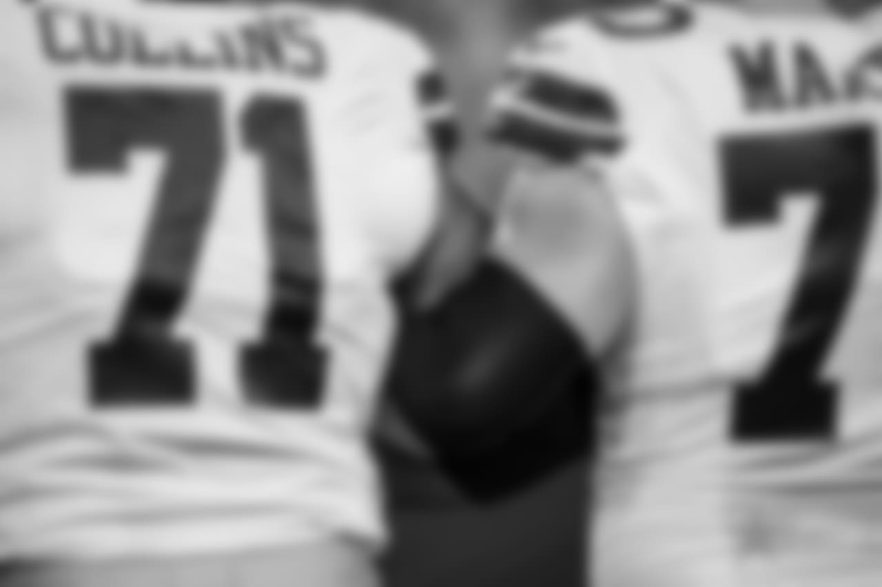 Dallas Cowboys offensive tackle La'el Collins (71) and guard Zack Martin (70) link arms together during the playing of the National Anthem prior to an NFL football game against the Arizona Cardinals on Monday, Sept. 25, 2017 in Glendale, Ariz. Dallas won 28-17. (Aaron M. Sprecher via AP)
