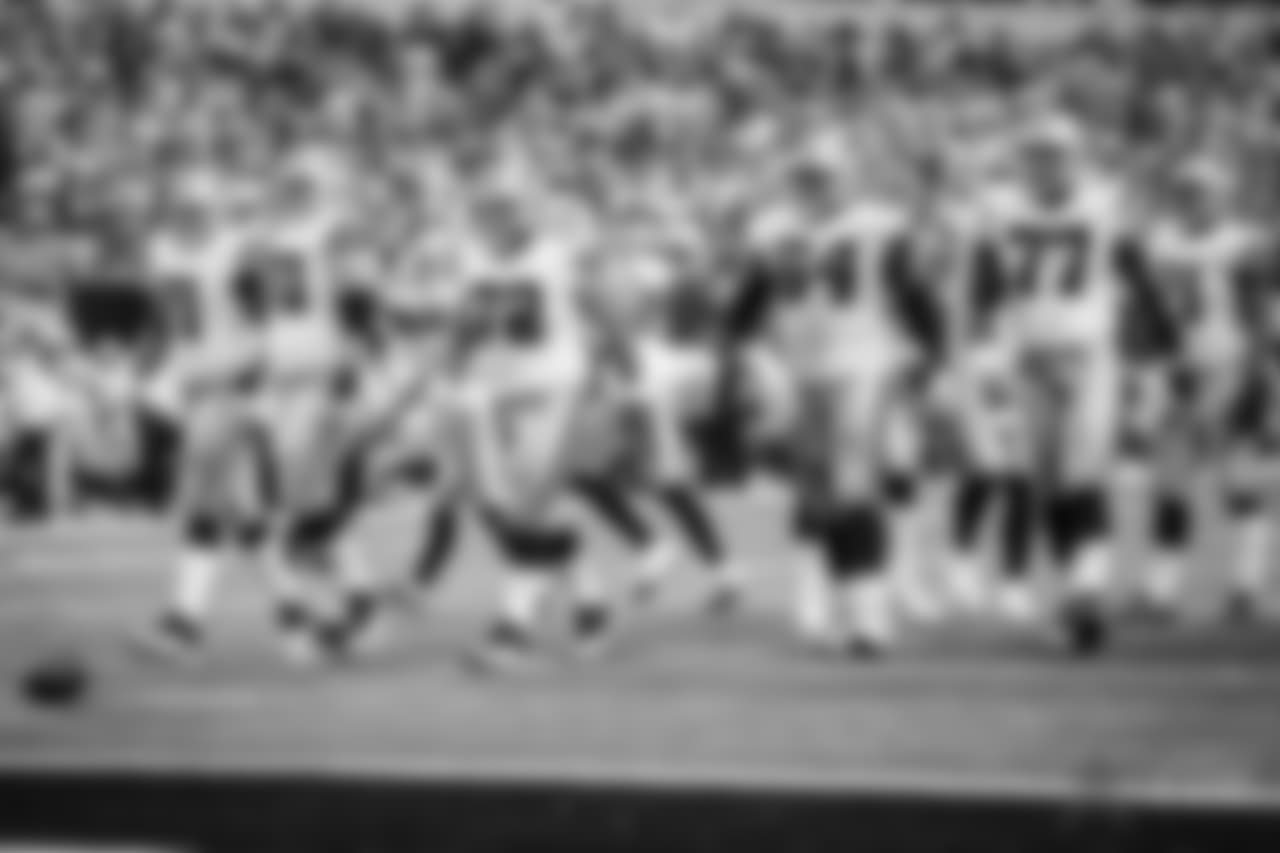 The Dallas Cowboys offense line including La'el Collins (71), Zack Martin (70), Travis Frederick (72), Jonathan Cooper (64), and Tyron Smith (77) walk to the line of scrimmage in action during an NFL football game against the Green Bay Packers on Sunday, Oct. 8, 2017 in Arlington, Texas. The Packers defeated the Cowboys 35-31. (G. Newman Lowrance via AP)