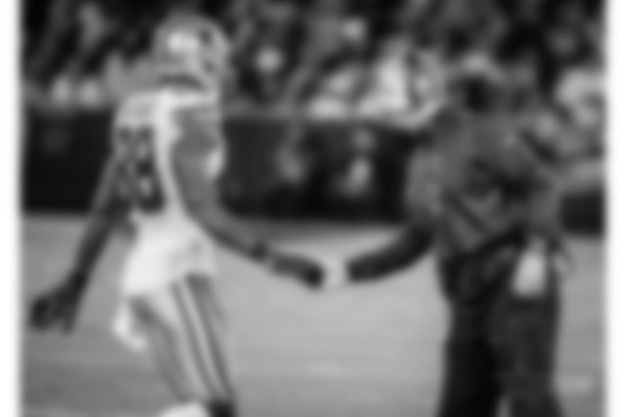 Dallas Cowboys wide receiver Dez Bryant (88) is greeted by head coach Jason Garrett during the first half of an NFL football game against the Oakland Raiders in Oakland, Calif., Sunday, Dec. 17, 2017. (AP Photo/Eric Risberg)