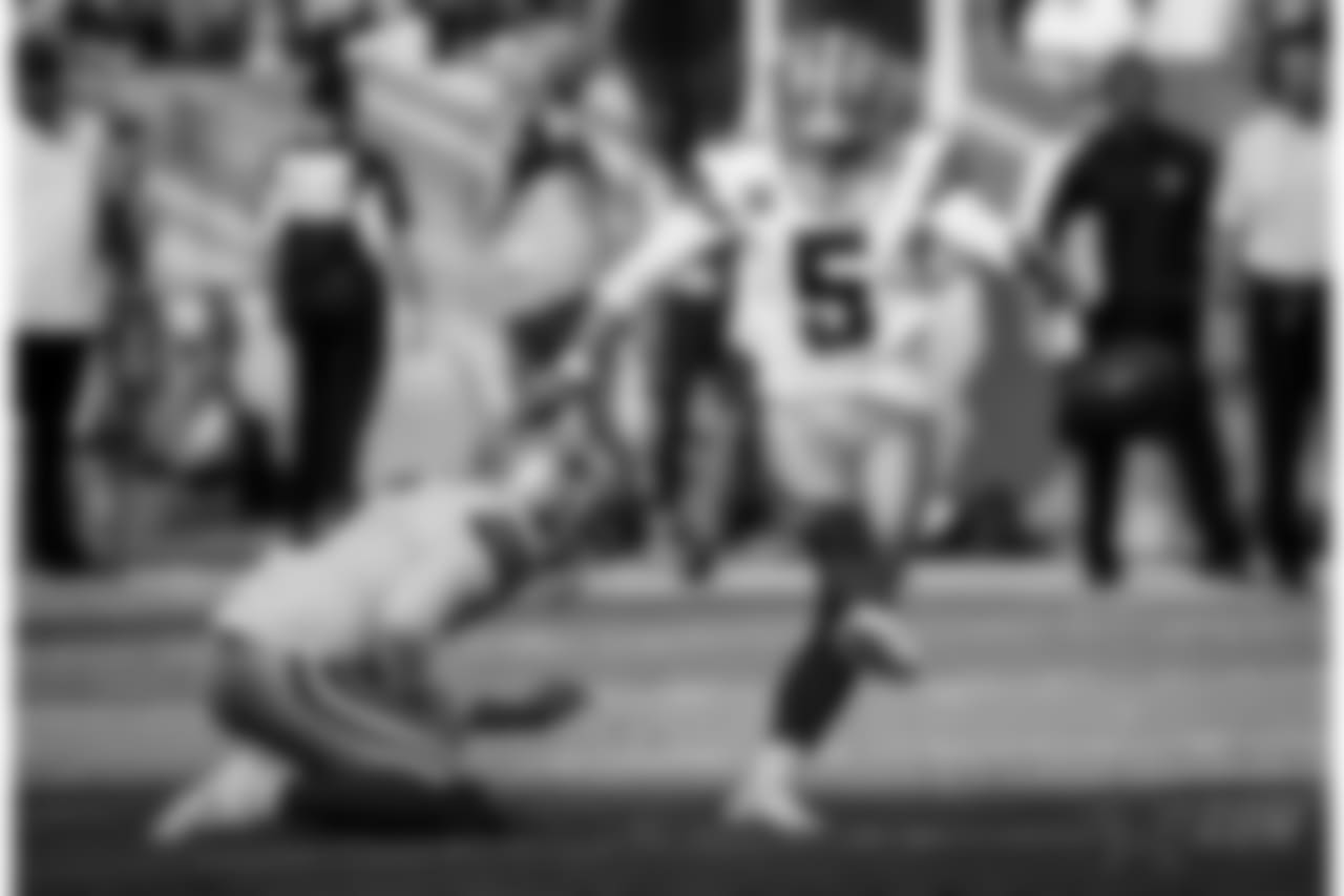 Dallas Cowboys kicker Dan Bailey (5) kicks a field goal as punter Chris Jones (6) holds against the Denver Broncos during the first half of an NFL football game, Sunday, Sept. 17, 2017, in Denver. (AP Photo/Jack Dempsey)