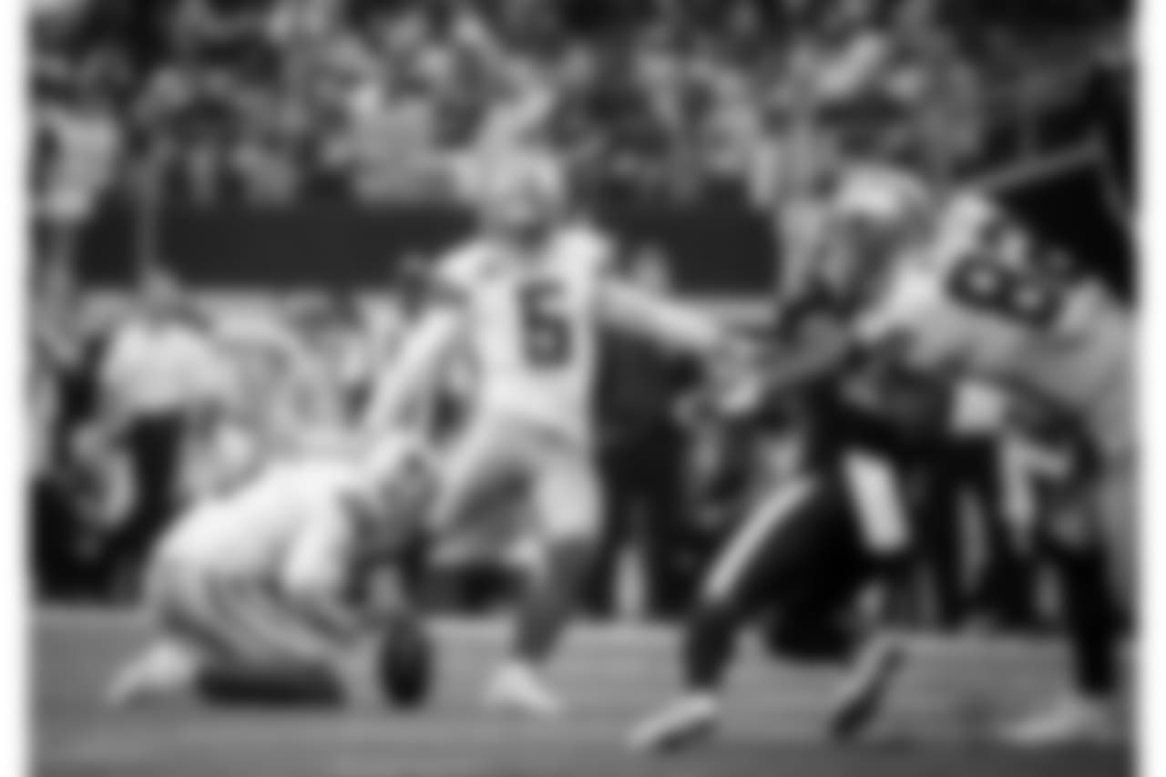 Los Angeles Rams punter Johnny Hekker (6) holds as Dallas Cowboys place kicker Dan Bailey (5) kicks during an NFL football game against the Los Angeles Rams on Sunday, Oct. 1, 2017, in Arlington, Texas. (AP Photo/Michael Ainsworth)