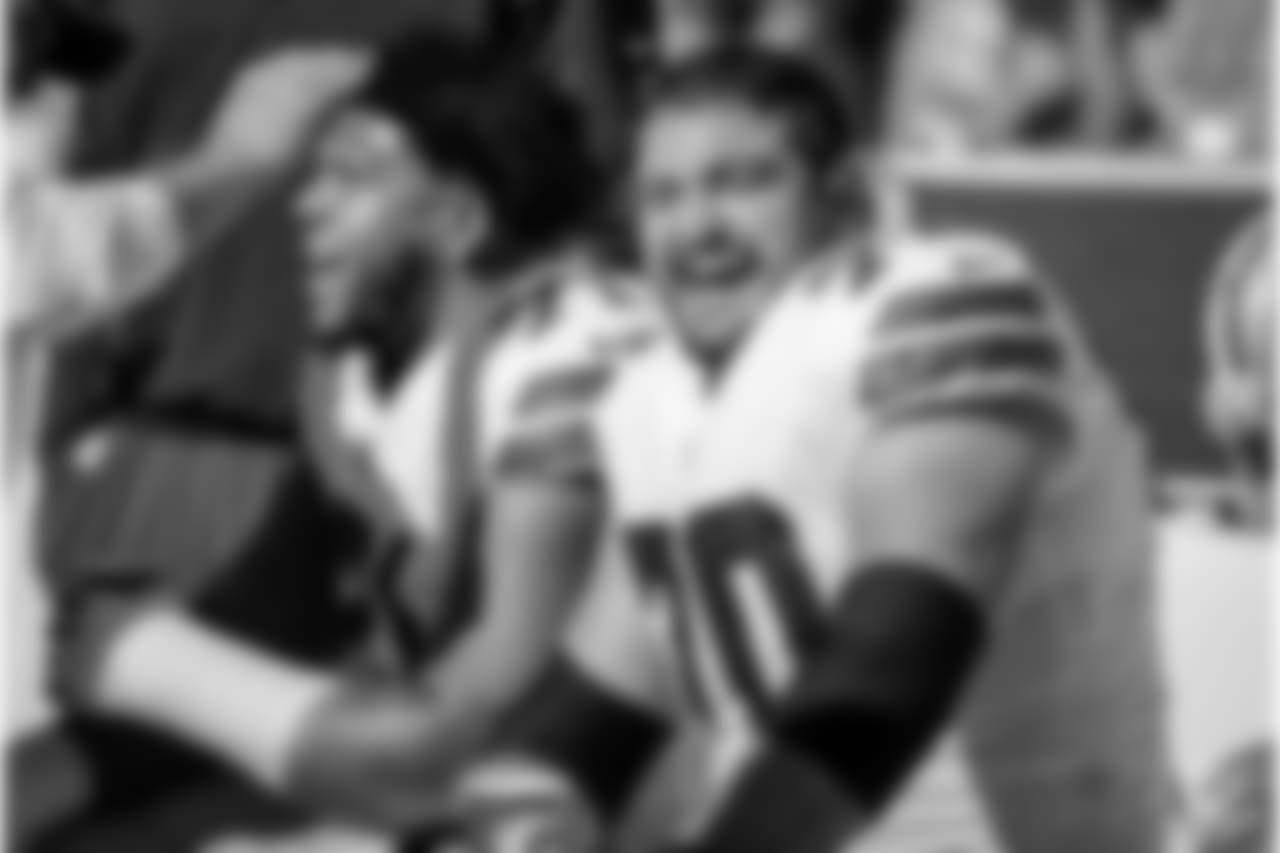 Dallas Cowboys guard Zack Martin (70) and offensive tackle La'el Collins (71) smile on the sideline during the second half of an NFL football game against the San Francisco 49ers in Santa Clara, Calif., Sunday, Oct. 22, 2017. (AP Photo/Eric Risberg)