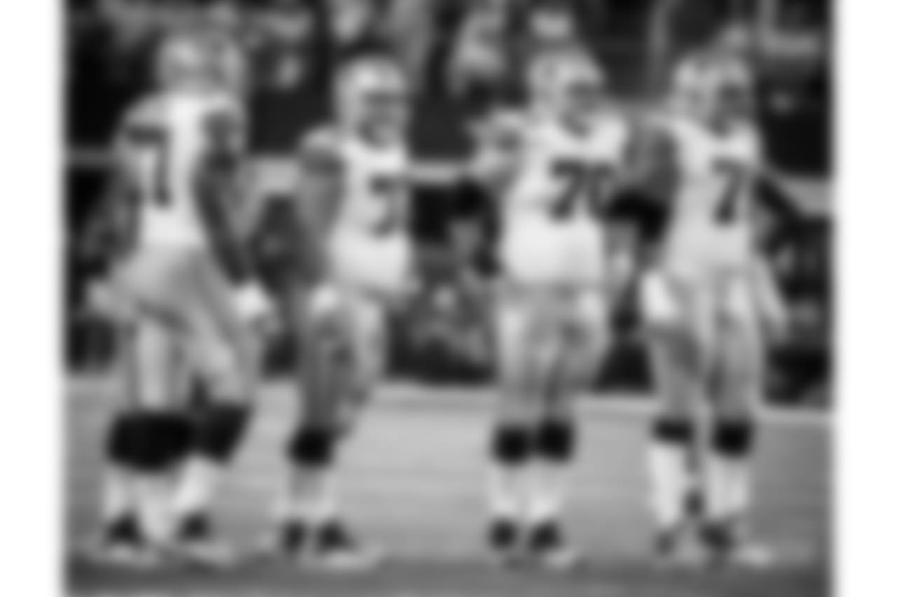 FILE - In this Sept. 10, 2017, file photo, Dallas Cowboys offensive tackle Tyron Smith (77), center Travis Frederick (72), guard Zack Martin (70) and offensive tackle La'el Collins (71) line up against the New York Giants during an NFL football game in Arlington, Texas. The Cowboys have two offensive linemen in new spots after the retirement of right tackle Doug Free and left guard Ron Leary’s departure in free agency. (AP Photo/Michael Ainsworth, File)