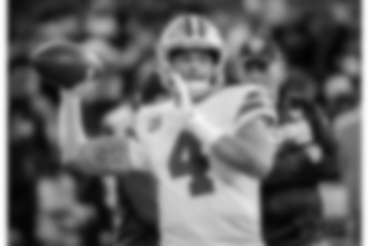 Dallas Cowboys quarterback Dak Prescott (4) warms up before an NFL football game against the Oakland Raiders in Oakland, Calif., Sunday, Dec. 17, 2017. (AP Photo/Eric Risberg)