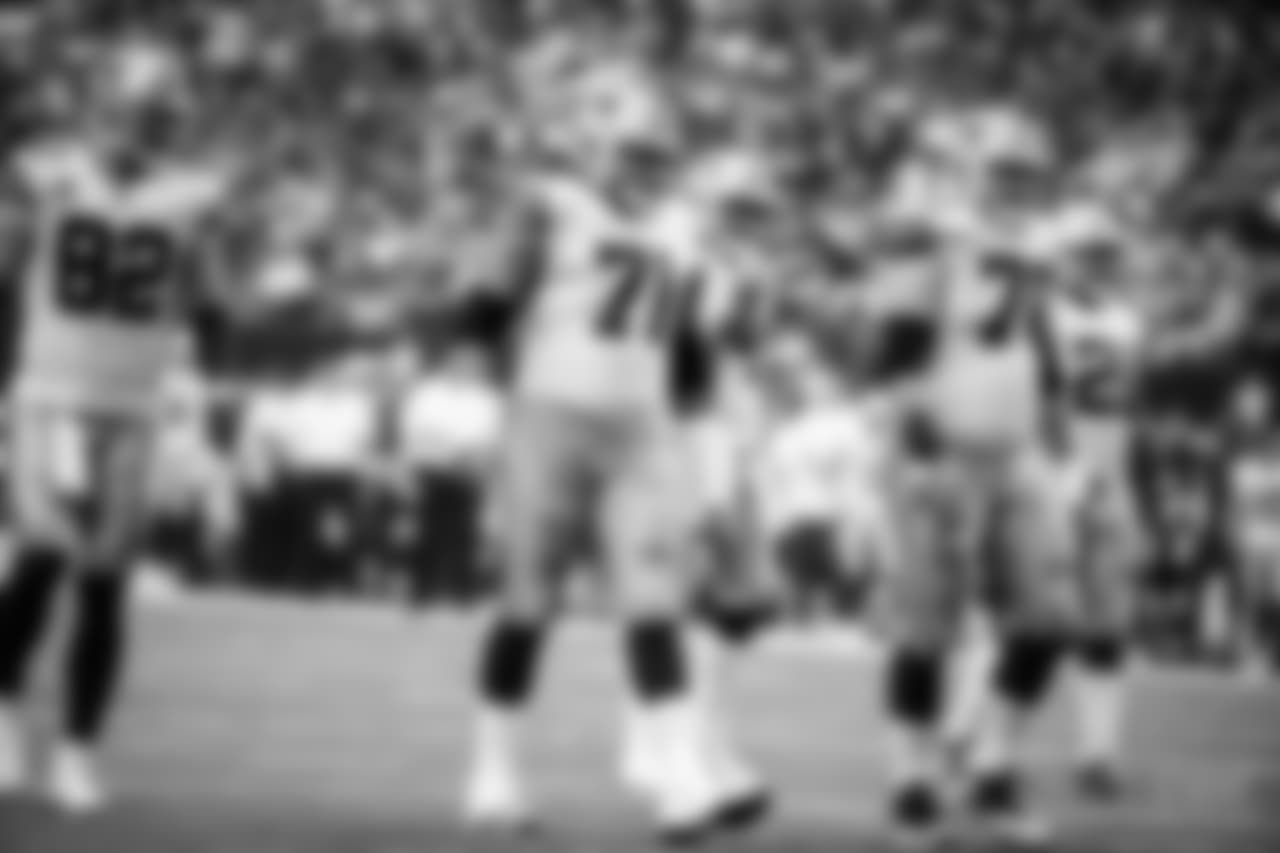 Dallas Cowboys' Jason Witten (82), La'el Collins (71), Dak Prescott (4), Zack Martin and Ezekiel Elliott (21) walk up to the line of scrimmage during an NFL football game against the Los Angeles Rams on Sunday, Oct. 1, 2017, in Arlington, Texas. (AP Photo/Michael Ainsworth)