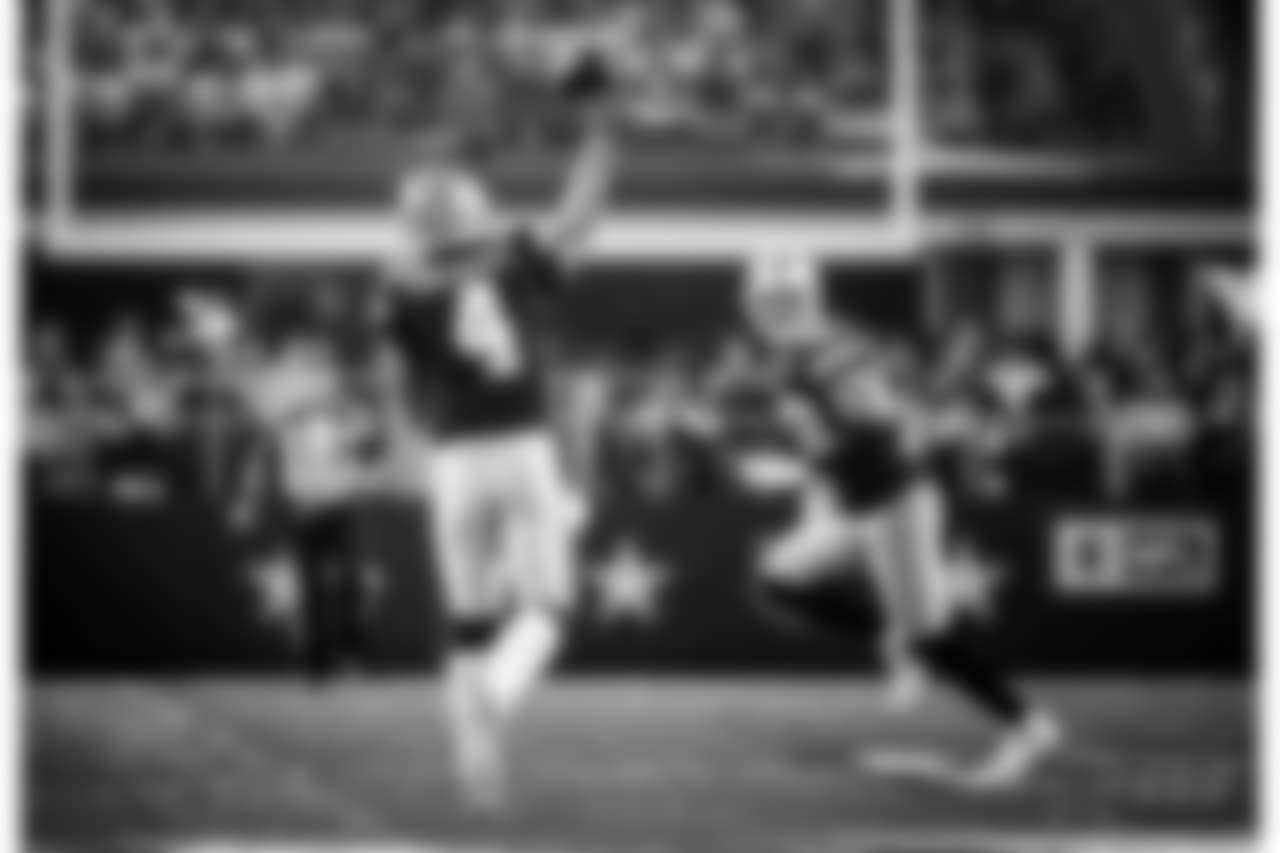 Dallas Cowboys quarterback Dak Prescott (4) throws a pass to tight end Jason Witten, rear, in the first half of an NFL football game against the Los Angeles Chargers on Thursday, Nov. 23, 2017, in Arlington, Texas. (AP Photo/Ron Jenkins)