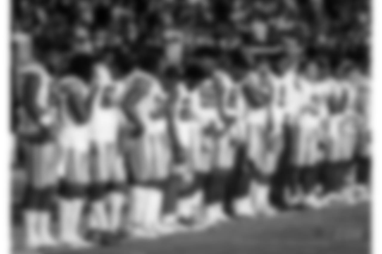 Dallas Cowboys players stand during the national anthem before the team's NFL preseason football game against the San Francisco 49ers in Santa Clara, Calif., Thursday, Aug. 9, 2018. (AP Photo/Tony Avelar)