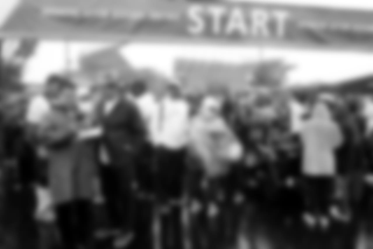 A group of participants waiting at the start line.