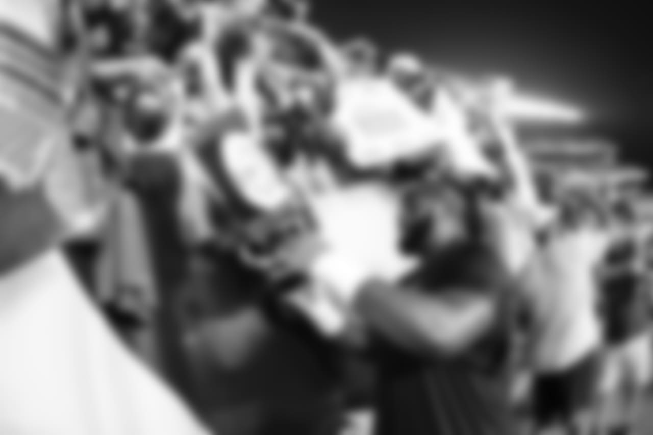 T Jason Peters signs autographs for fans at public practice.