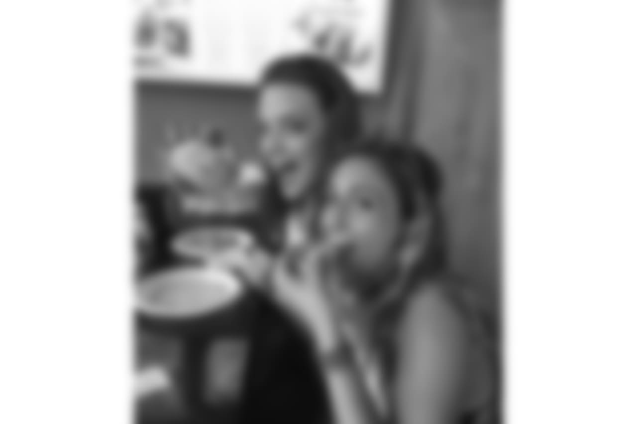 Danielle and Amanda Grace enjoying tacos after their calendar shoot
