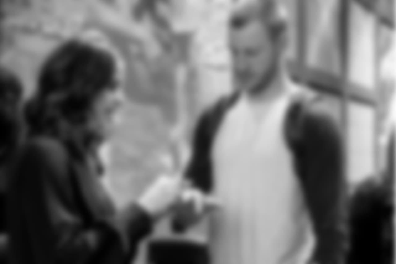 QB Carson Wentz preparing his hand to be sized.