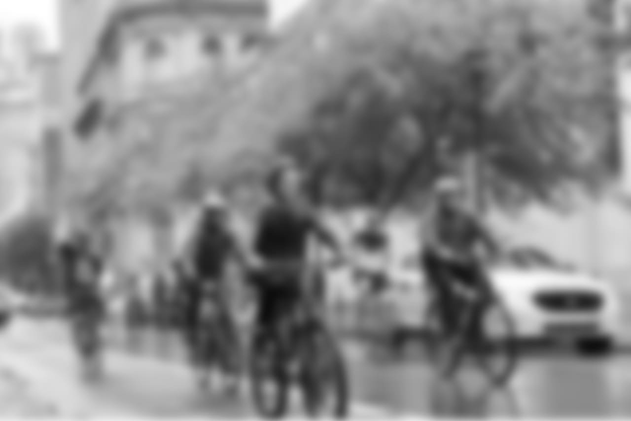 Cyclists riding past Jefferson Hospital.