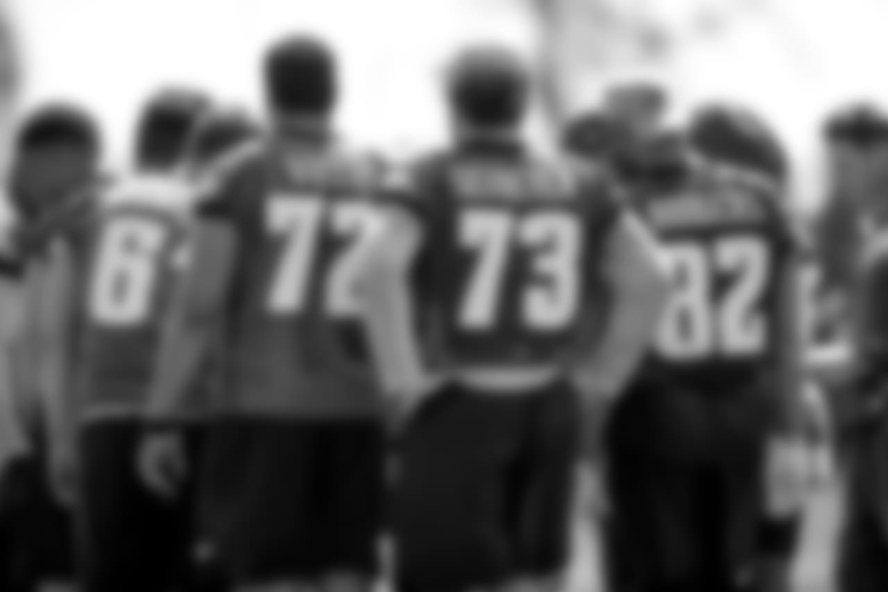 Members of the Eagles' offensive line huddle up.