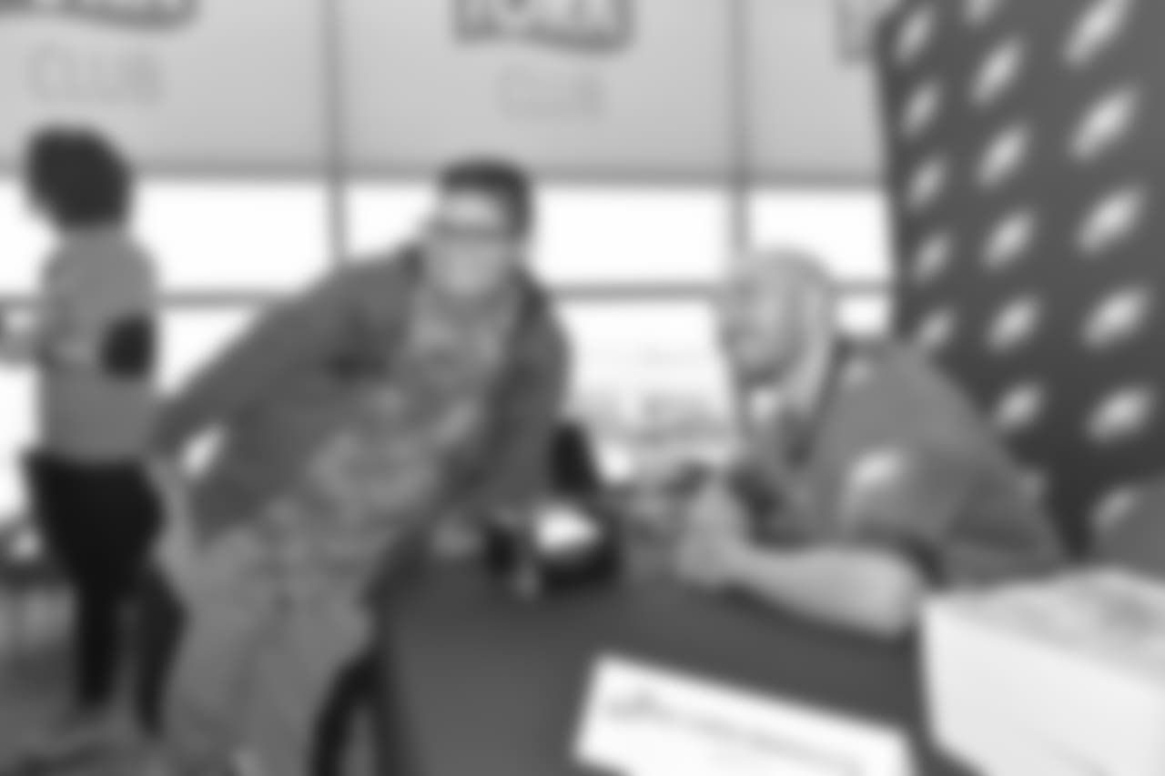 S Chris Maragos smiles with a fan