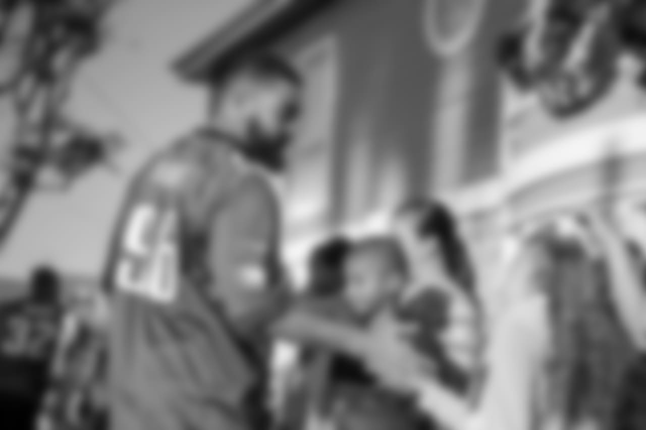 DE Derek Barnett greets children as he enters the Orange County Ronald McDonald House.