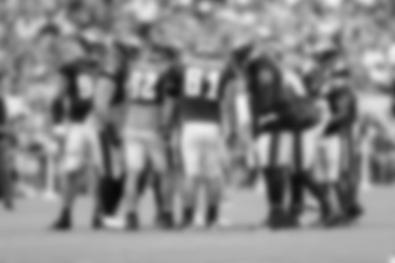 The offensive line huddled up