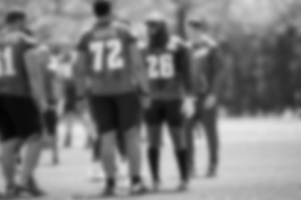 RB Jay Ajayi and OT Halapoulivaati Vaitai chat during practice.