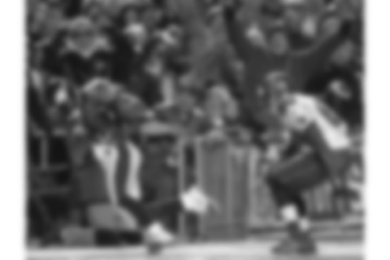 Brian Dawkins snares the interception with a tip-toe move in the playoffs against the Bucs