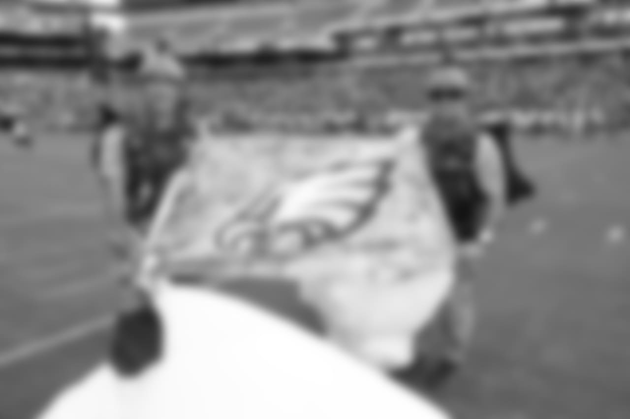 The Frog-X Parachute Team lands in Lincoln Financial Field.