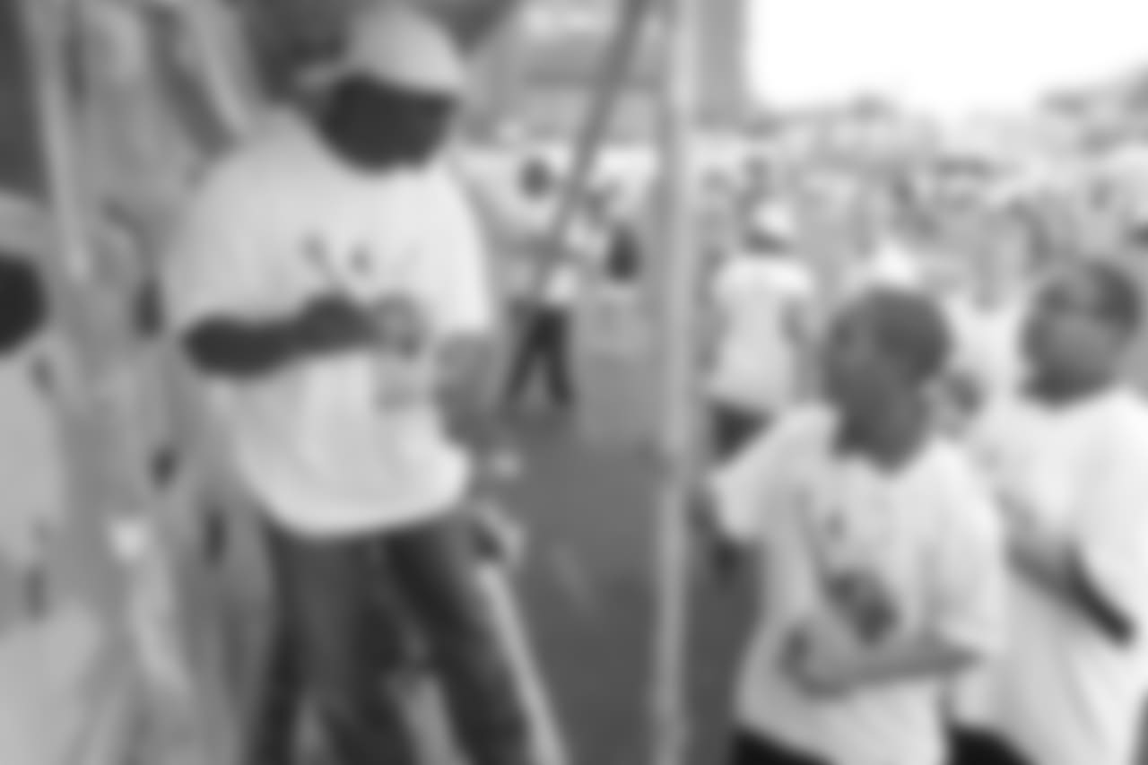 Dawkins interacts with kids at the annual Eagles Youth Partnership Playground Build