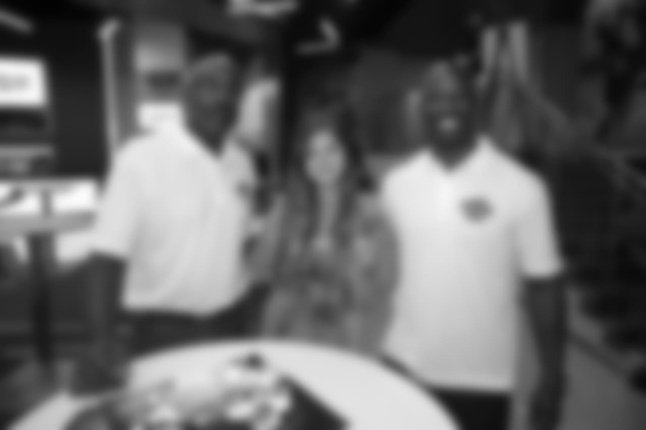 Mike Quick and Jason Avant with a lucky fan.