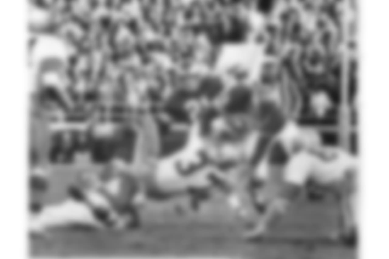 Maxie Baughan lays down a hard hit at Franklin Field in 1964.