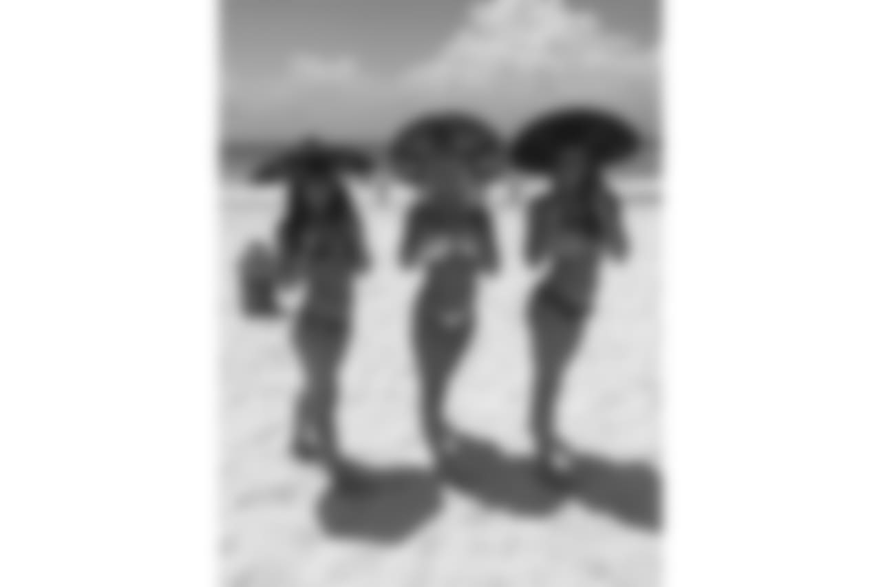 Diane, Victoria and Jess tried on some sombreros on the beach