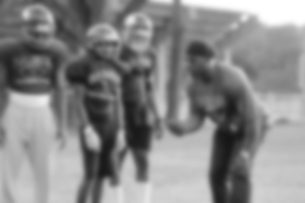 Brian Dawkins coaches Raines football players during practice